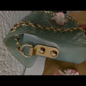 Baby blue bag with gold and black detailing
